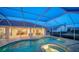 Outdoor pool and patio area with lake view at 7412 Links Ct, Sarasota, FL 34243