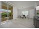 Modern dining area with a table and chairs near balcony at 750 N Tamiami Trl # 314, Sarasota, FL 34236