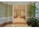 Bright hallway with light walls and tiled floors at 750 N Tamiami Trl # 314, Sarasota, FL 34236