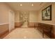 Elegant hallway with tiled floors and artwork at 750 N Tamiami Trl # 314, Sarasota, FL 34236