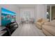 Living area featuring contemporary furniture and large TV at 750 N Tamiami Trl # 314, Sarasota, FL 34236