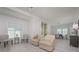 Bright living room with light flooring and comfy seating at 750 N Tamiami Trl # 314, Sarasota, FL 34236