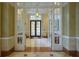 Elegant building lobby with double doors and tiled floors at 750 N Tamiami Trl # 314, Sarasota, FL 34236