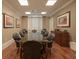 Elegant meeting room with large table and leather chairs at 750 N Tamiami Trl # 314, Sarasota, FL 34236