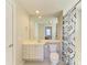 Well-lit bathroom with a shower/tub combo and a vanity with drawers at 7879 Bergamo Ave, Sarasota, FL 34238