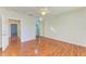 Spacious bedroom with wood flooring and mirrored closet doors at 7879 Bergamo Ave, Sarasota, FL 34238