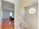 View of bedroom with hardwood floors and a glimpse of a bed at 7879 Bergamo Ave, Sarasota, FL 34238