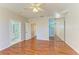 Well-lit bedroom with wood floors and access to bathroom at 7879 Bergamo Ave, Sarasota, FL 34238