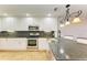 Well-equipped kitchen featuring stainless steel appliances and granite counters at 7879 Bergamo Ave, Sarasota, FL 34238