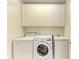 Convenient laundry room with washer, dryer, and cabinets at 7879 Bergamo Ave, Sarasota, FL 34238