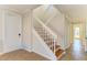 Elegant staircase with wood treads and white railings at 7879 Bergamo Ave, Sarasota, FL 34238