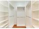 Large walk-in closet with ample shelving and hanging space at 7879 Bergamo Ave, Sarasota, FL 34238