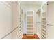 Bright walk-in closet with shelves and hanging space at 7879 Bergamo Ave, Sarasota, FL 34238