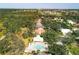 Community pool and surrounding houses, aerial view at 804 Connemara Cir, Venice, FL 34292