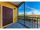 Screened balcony with view of parking lot and trees at 8335 38Th Street E Cir # 303, Sarasota, FL 34243