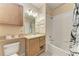 Bathroom with light wood vanity and a tub shower combo at 8335 38Th Street E Cir # 303, Sarasota, FL 34243