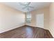 Spacious bedroom with wood-look floors and ceiling fan at 8335 38Th Street E Cir # 303, Sarasota, FL 34243