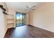 Bedroom with balcony access and wood floors at 8335 38Th Street E Cir # 303, Sarasota, FL 34243