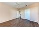 Spacious bedroom with dark wood floors and ceiling fan at 8335 38Th Street E Cir # 303, Sarasota, FL 34243