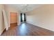 Bedroom with wood-look floors, closet, and window at 8335 38Th Street E Cir # 303, Sarasota, FL 34243