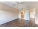 Spacious bedroom with dark wood floors and ceiling fan at 8335 38Th Street E Cir # 303, Sarasota, FL 34243