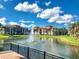 Tranquil lake view with a water fountain feature at 8335 38Th Street E Cir # 303, Sarasota, FL 34243