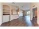 Open living area with wood-look floors and adjacent kitchen at 8335 38Th Street E Cir # 303, Sarasota, FL 34243