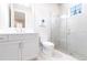 Modern bathroom with white vanity, shower, and toilet at 8497 Pavia Way, Bradenton, FL 34202