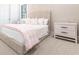 Bedroom with wicker bed and pink bedding at 8497 Pavia Way, Bradenton, FL 34202