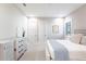 Light and airy bedroom with white furniture and carpeted floor at 8497 Pavia Way, Bradenton, FL 34202