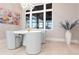 Breakfast nook with light blue chairs and round white table near window at 8497 Pavia Way, Bradenton, FL 34202