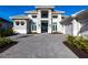 Two-story home with paver driveway & landscaping at 8497 Pavia Way, Bradenton, FL 34202