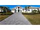 Two-story home with paver driveway & landscaping at 8497 Pavia Way, Bradenton, FL 34202