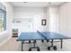 Game room with two ping pong tables and a wet bar at 8497 Pavia Way, Bradenton, FL 34202