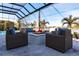 Covered patio with fire pit and comfortable seating at 8497 Pavia Way, Bradenton, FL 34202