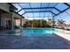 Enclosed pool and spa with lake view at 8497 Pavia Way, Bradenton, FL 34202