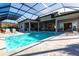 Stunning pool with water features and covered patio at 8497 Pavia Way, Bradenton, FL 34202