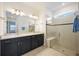 Bathroom with double vanity and walk-in shower at 9405 Ballaster Pointe Loop, Parrish, FL 34219