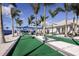 Outdoor bocce ball courts with palm trees and covered seating offer residents a fun recreational opportunity at 9405 Ballaster Pointe Loop, Parrish, FL 34219