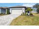 New home exterior with paver driveway and landscaping at 9405 Ballaster Pointe Loop, Parrish, FL 34219