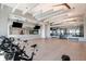 Well-equipped gym with stationary bikes, mirrored walls, and stylish ceiling design at 9405 Ballaster Pointe Loop, Parrish, FL 34219