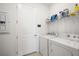 Laundry room with washer, dryer, and shelving at 9405 Ballaster Pointe Loop, Parrish, FL 34219