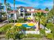 Two-story house with pool and lush landscaping at 1023 Tocobaga Ln, Sarasota, FL 34236