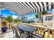 Outdoor patio with dining furniture and a view of the water at 1023 Tocobaga Ln, Sarasota, FL 34236