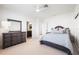 Charming bedroom with a queen-size bed and access to a bathroom at 1023 Tocobaga Ln, Sarasota, FL 34236