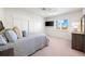 Comfortable bedroom with striped bedding and large window at 1023 Tocobaga Ln, Sarasota, FL 34236