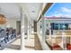 Sunlit dining room with large windows and arched columns at 1023 Tocobaga Ln, Sarasota, FL 34236