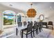 Elegant dining room with a large table and statement chandelier at 1023 Tocobaga Ln, Sarasota, FL 34236