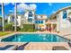 Inviting pool area with ample deck space and lush landscaping at 1023 Tocobaga Ln, Sarasota, FL 34236