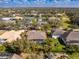 A captivating aerial view of a home surrounded by lush greenery and a screened pool area at 1069 Harbour Cape Pl, Punta Gorda, FL 33983